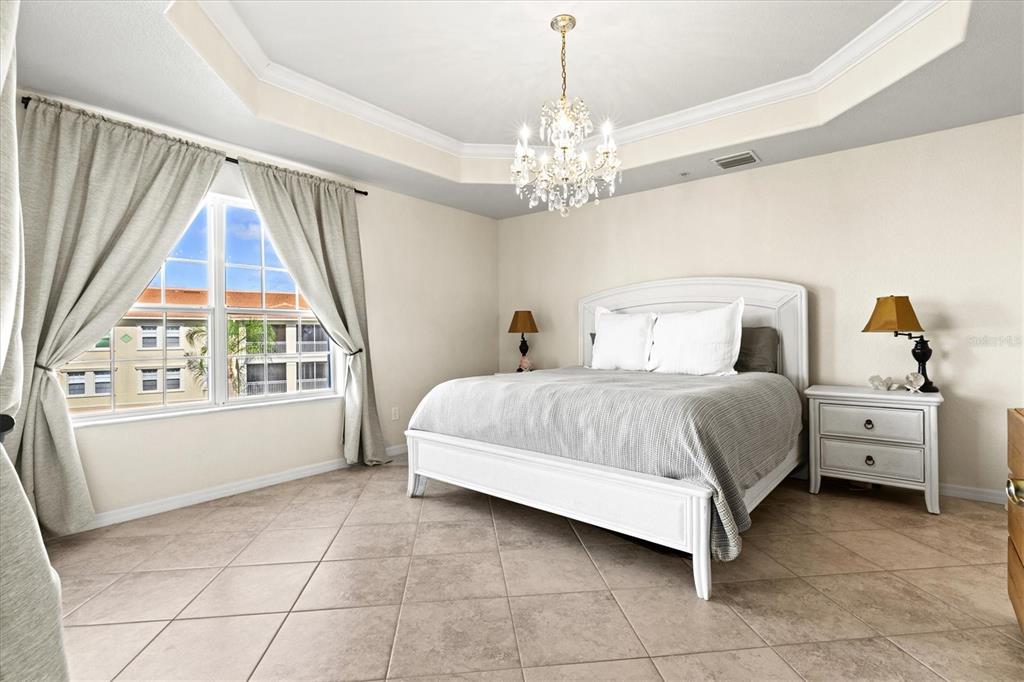 1000 San Lino Circle, Unit 1032 Venice, FL 34292 - Photo 25 of 88 a bedroom with a large bed and a window