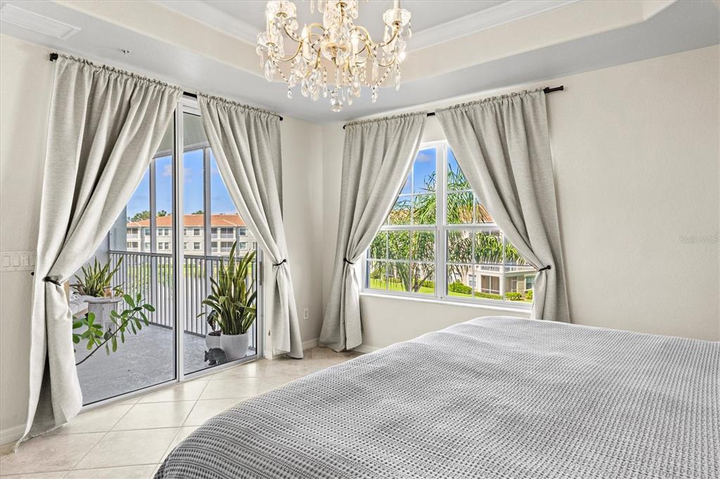 1000 San Lino Circle, Unit 1032 Venice, FL 34292 - Photo 28 of 88 a very nice looking room with a large window and a bed