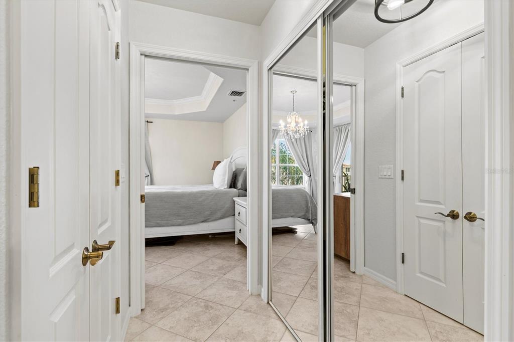 1000 San Lino Circle, Unit 1032 Venice, FL 34292 - Photo 30 of 88 a bedroom with a bed and glass door