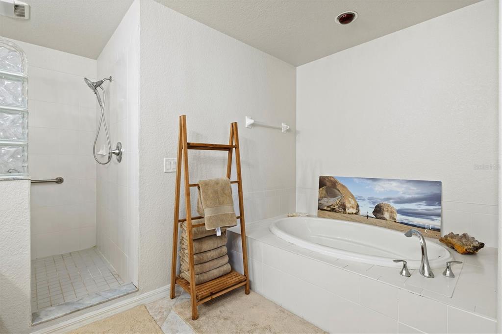 1000 San Lino Circle, Unit 1032 Venice, FL 34292 - Photo 31 of 88 a bathroom with a tub and a shower