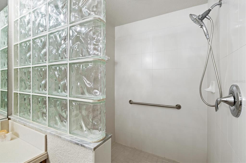 1000 San Lino Circle, Unit 1032 Venice, FL 34292 - Photo 33 of 88 a bathroom with a glass shower door