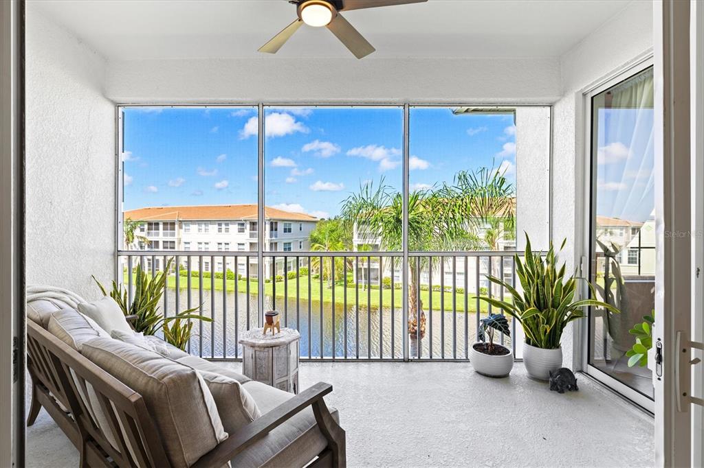 1000 San Lino Circle, Unit 1032 Venice, FL 34292 - Photo 38 of 88 a living room with furniture and floor to ceiling window