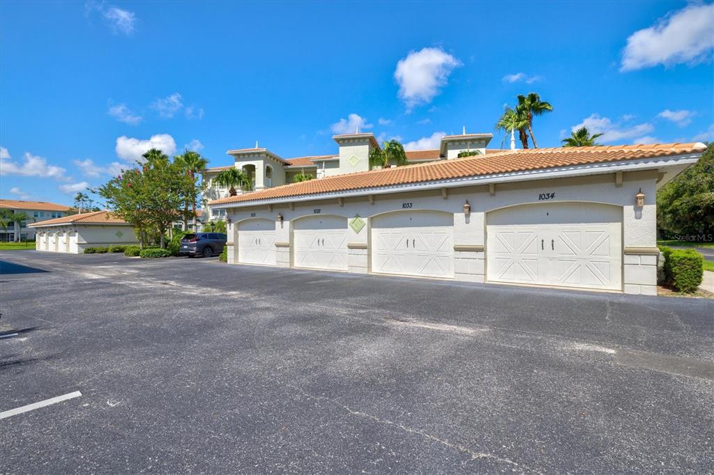 1000 San Lino Circle, Unit 1032 Venice, FL 34292 - Photo 41 of 88 a view of a house with a garage and yard