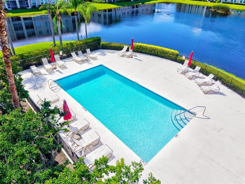 1000 San Lino Circle, Unit 1032 Venice, FL 34292 - Photo 43 of 88 a view of a backyard with a table and chairs