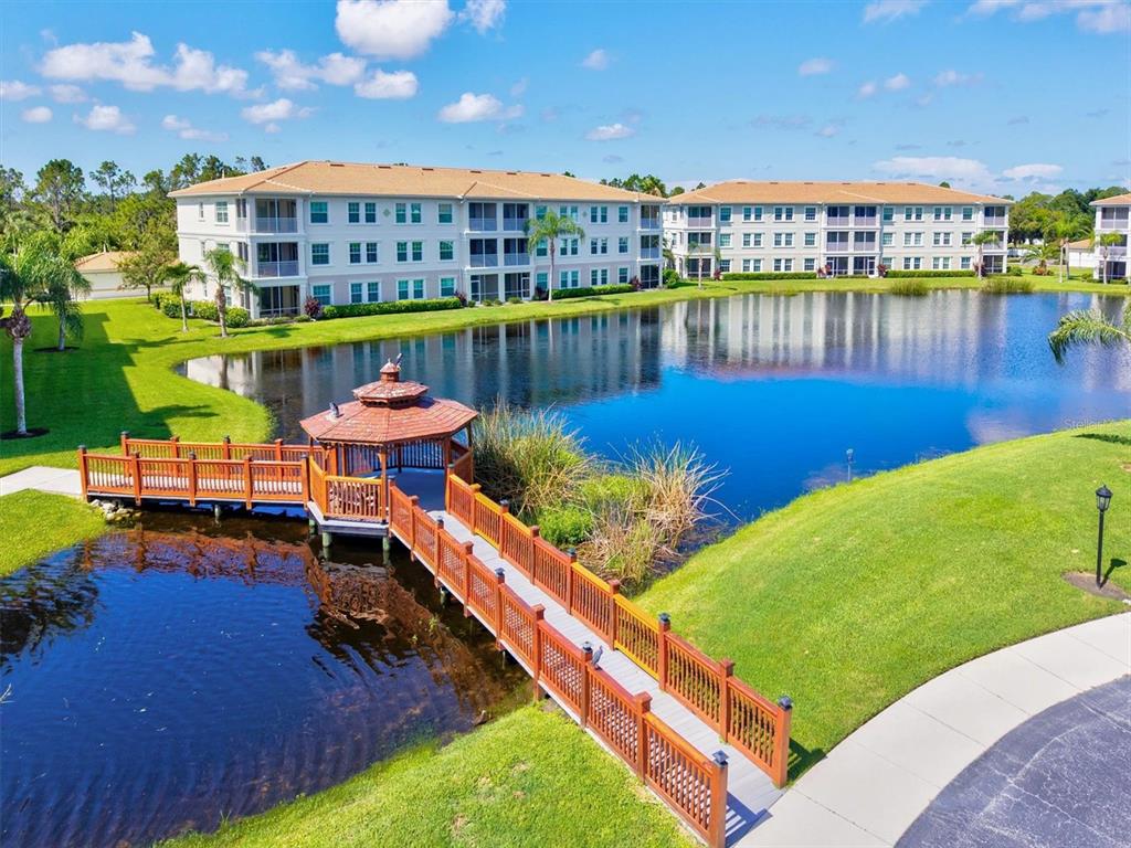 1000 San Lino Circle, Unit 1032 Venice, FL 34292 - Photo 46 of 88 a view of a swimming pool with outdoor seating space
