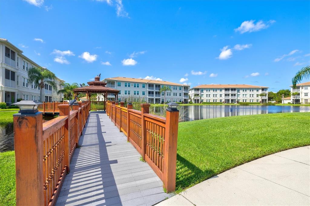 1000 San Lino Circle, Unit 1032 Venice, FL 34292 - Photo 48 of 88 a view of a swimming pool and outdoor seating