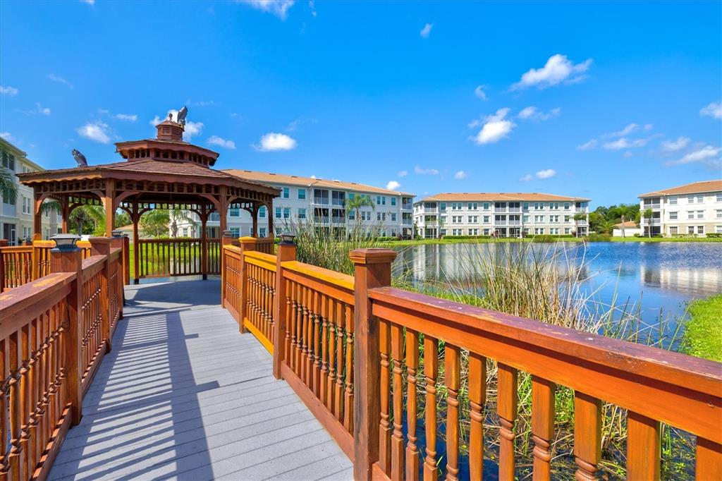 1000 San Lino Circle, Unit 1032 Venice, FL 34292 - Photo 49 of 88 a view of a balcony with wooden chairs