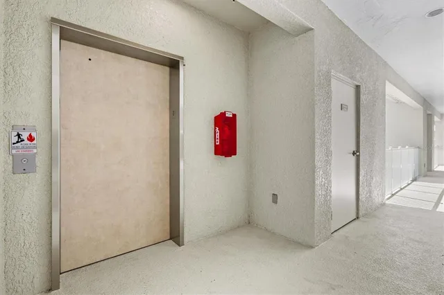 a kitchen with stainless steel appliances granite countertop a refrigerator a oven and a sink