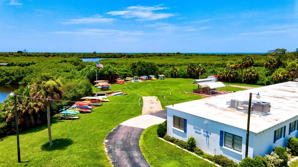 1000 San Lino Circle, Unit 1032 Venice, FL 34292 - Photo 88 of 88 a view of a house with a yard and potted plants