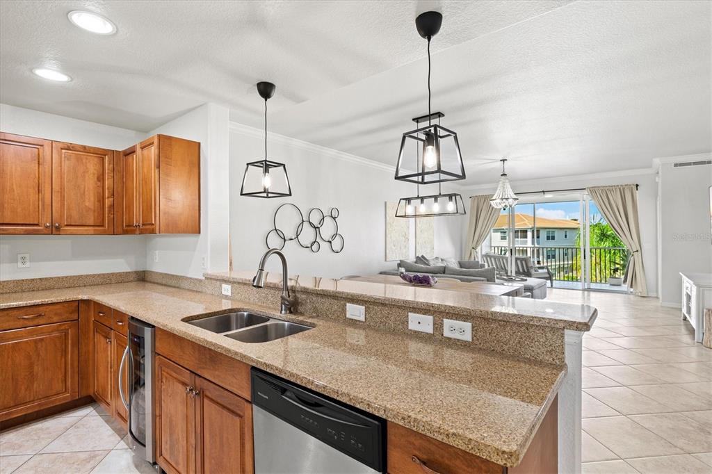 1000 San Lino Circle, Unit 1032 Venice, FL 34292 - Photo 10 of 88 a kitchen with sink cabinets and window