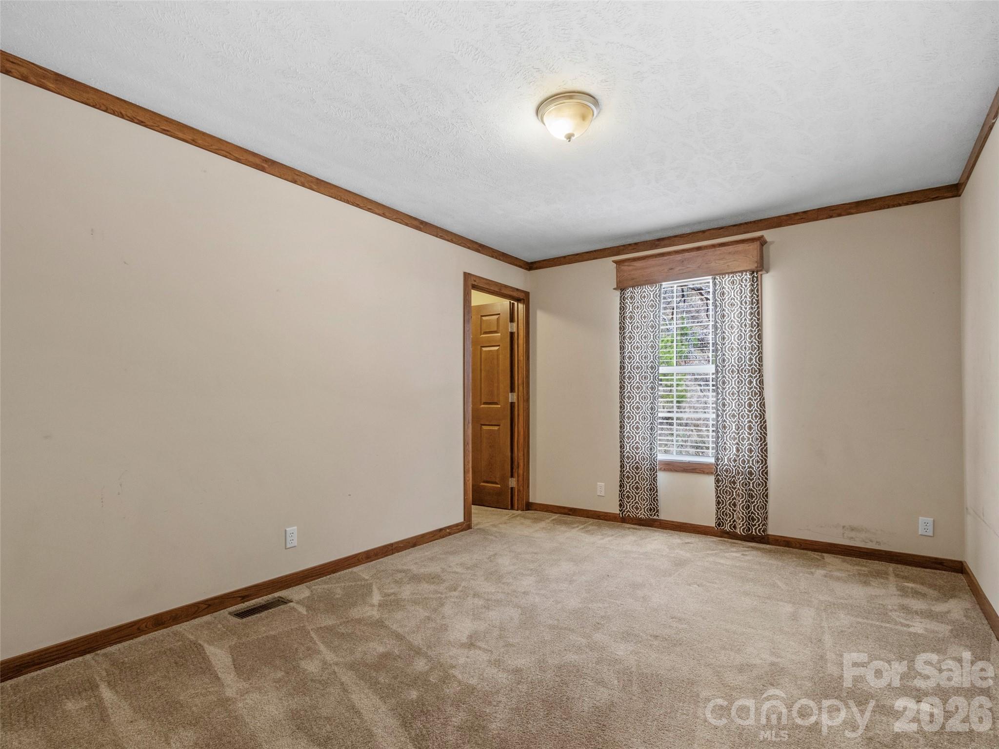 695 Johnson Farm Road Canton, NC 28716 - Photo 24 of 37 a view of an empty room with a window