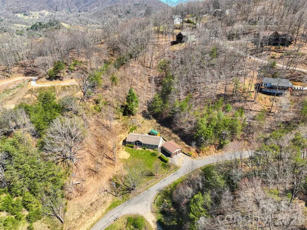 a aerial view of a house with a yard