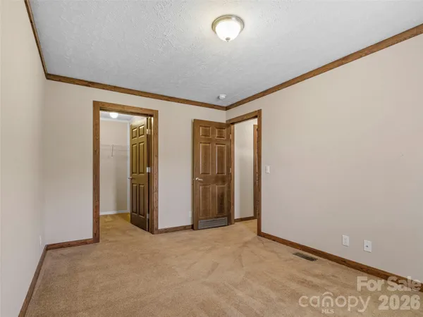 an empty room with closet area