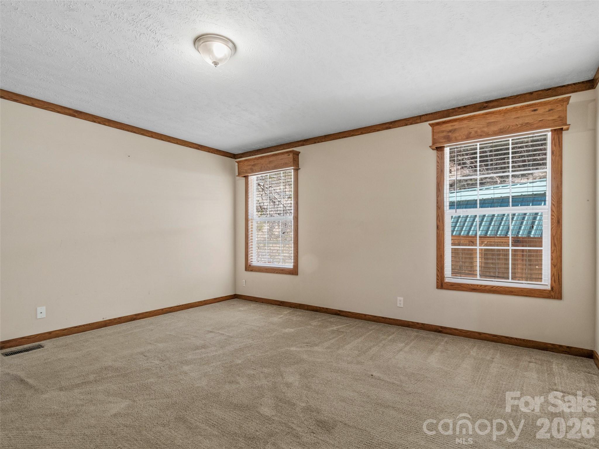 695 Johnson Farm Road Canton, NC 28716 - Photo 10 of 37 an empty room with windows