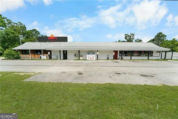 a view of house with yard and entertaining space
