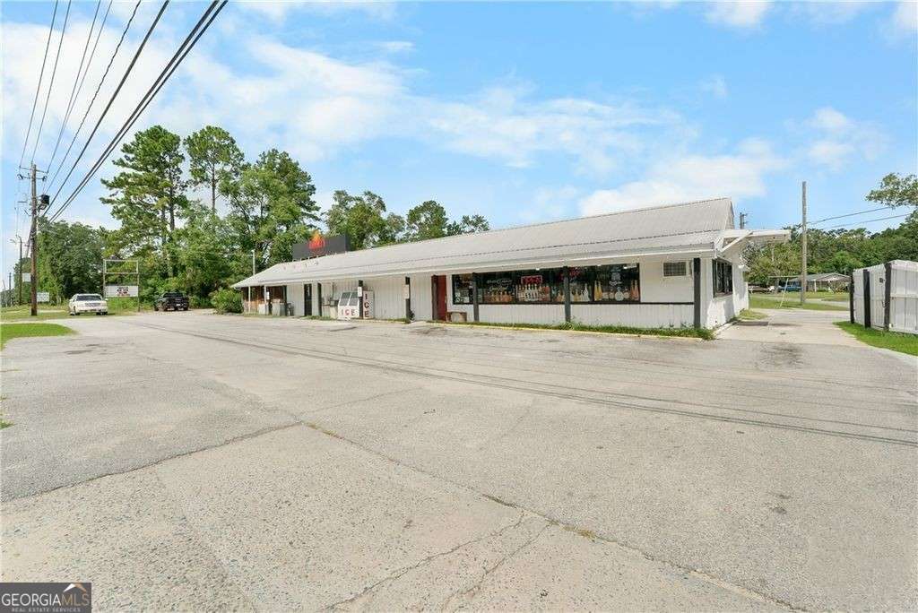 512 Highway 301 Jesup, GA 31546 - Photo 5 of 20 a view of house with outdoor space and sitting area