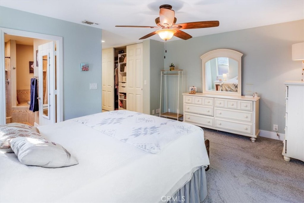 9541 Mandeville Road Santee, CA 92071 - Photo 16 of 46 a bedroom with a bed and a chandelier