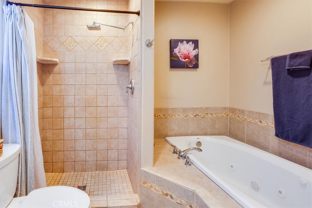 9541 Mandeville Road Santee, CA 92071 - Photo 20 of 46 a bathroom with a bathtub and a shower