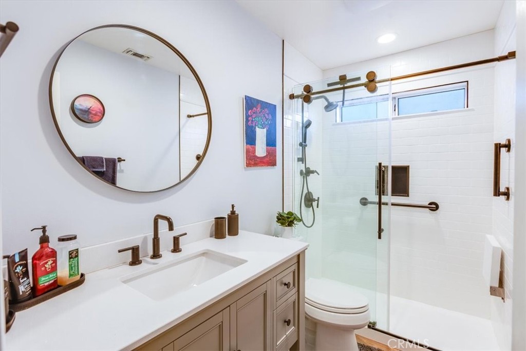 9541 Mandeville Road Santee, CA 92071 - Photo 23 of 46 a bathroom with a sink and a mirror