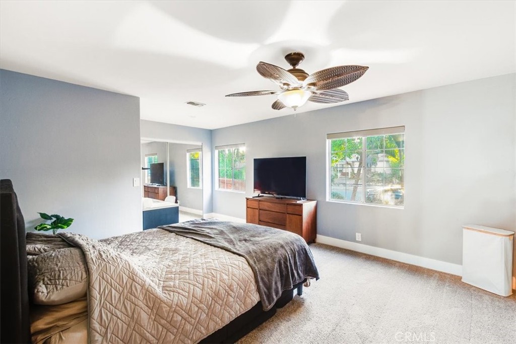 9541 Mandeville Road Santee, CA 92071 - Photo 27 of 46 a bedroom with a bed and a flat screen tv