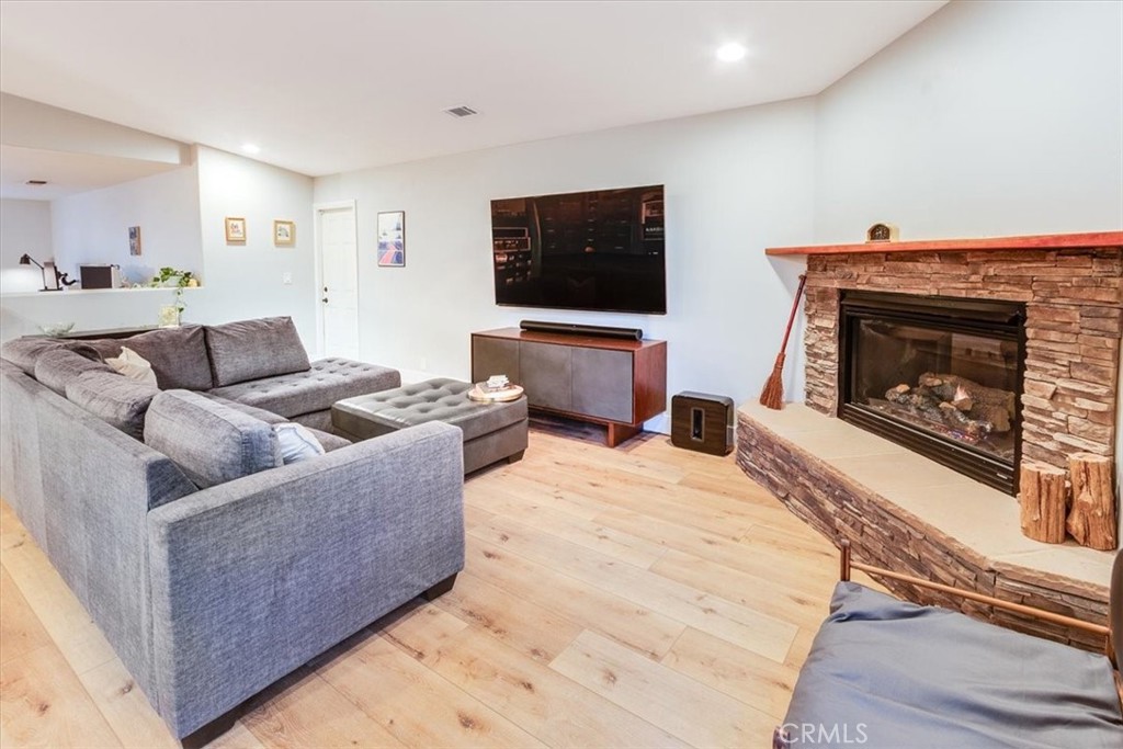 9541 Mandeville Road Santee, CA 92071 - Photo 6 of 46 a living room with furniture a flat screen tv and a fireplace