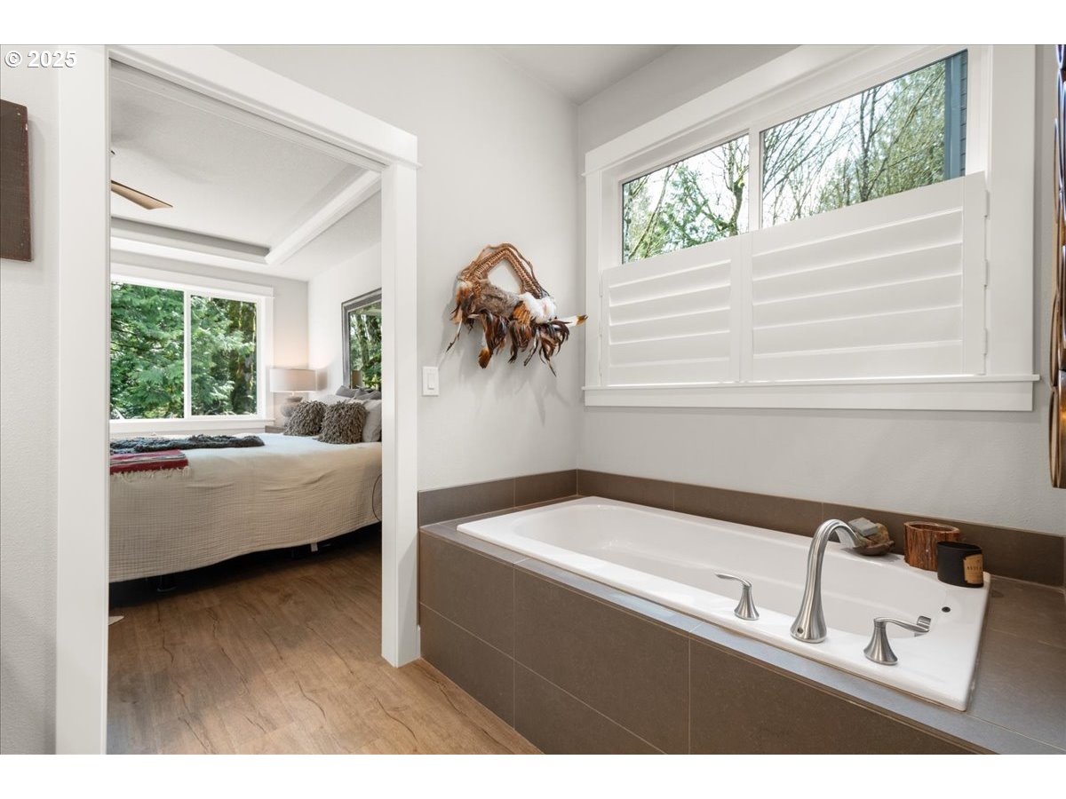 1715 Northeast 169th Street Ridgefield, WA 98642 - Photo 21 of 43 a en suite bathroom with a bathtub and a window