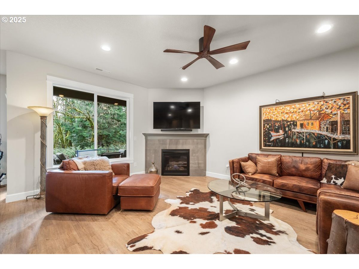 1715 Northeast 169th Street Ridgefield, WA 98642 - Photo 5 of 43 a living room with furniture and a fireplace