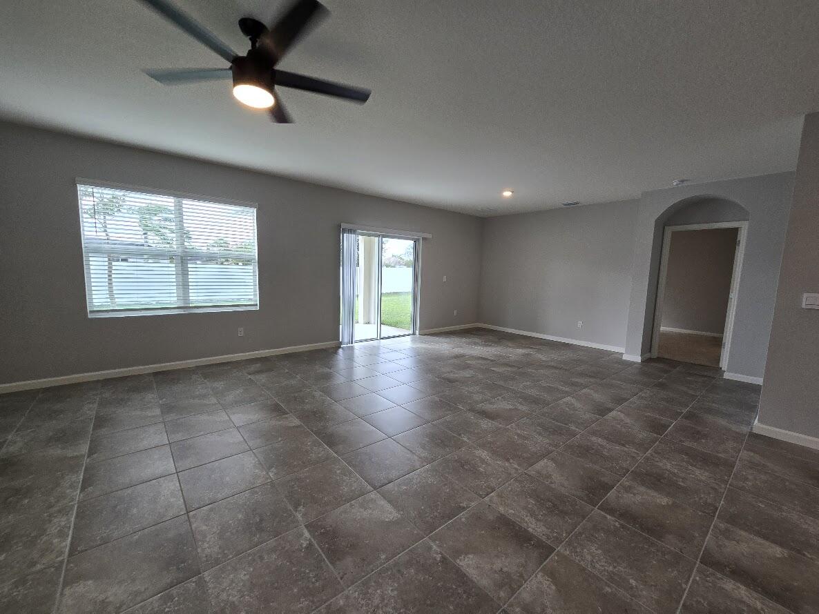234 Southwest Becker Road Port St. Lucie, FL 34953 - Photo 19 of 44 a view of an empty room with a window