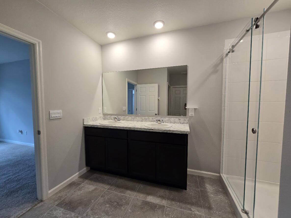 234 Southwest Becker Road Port St. Lucie, FL 34953 - Photo 24 of 44 a bathroom with a sink and a mirror