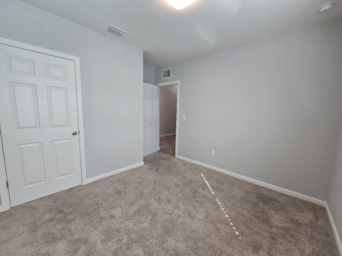 234 Southwest Becker Road Port St. Lucie, FL 34953 - Photo 32 of 44 a view of an empty room and closet area