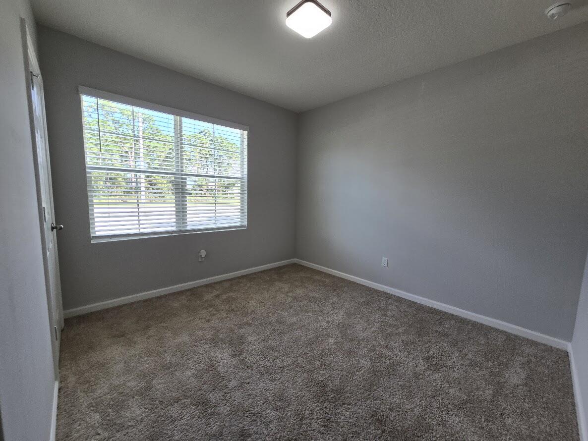 234 Southwest Becker Road Port St. Lucie, FL 34953 - Photo 33 of 44 an empty room with a window