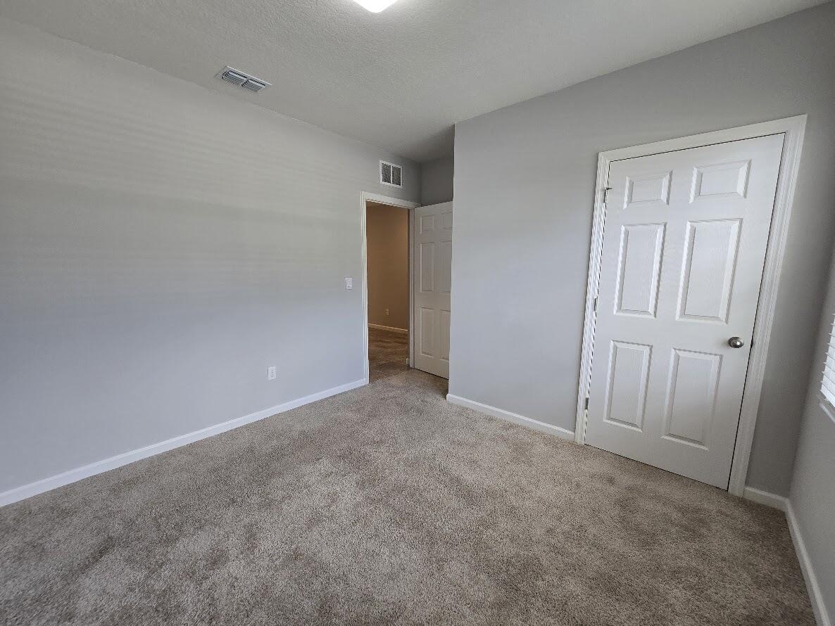 234 Southwest Becker Road Port St. Lucie, FL 34953 - Photo 34 of 44 a view of an empty room