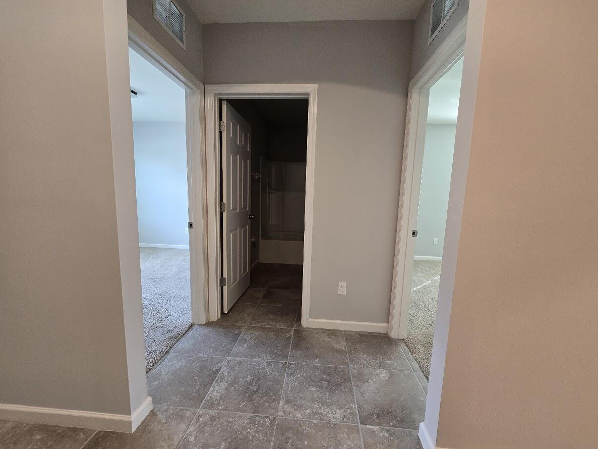 234 Southwest Becker Road Port St. Lucie, FL 34953 - Photo 35 of 44 a view of a hallway with wooden shelves