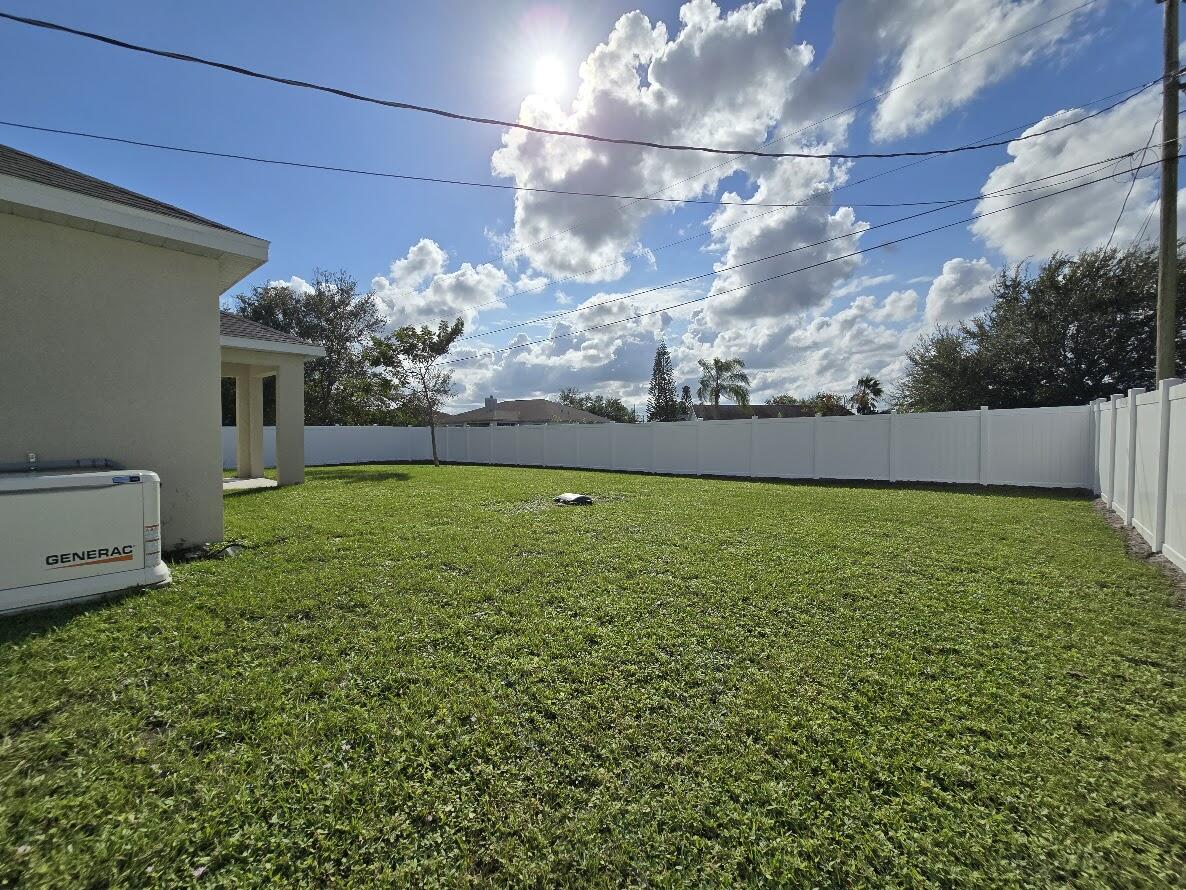 234 Southwest Becker Road Port St. Lucie, FL 34953 - Photo 7 of 44 a view of a yard in front of a house