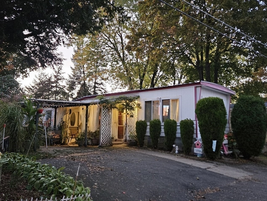 40 Better Way Springfield, MA 01119 - Photo 1 of 25 a view of a house with large windows and plants