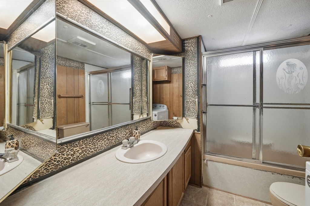 40 Better Way Springfield, MA 01119 - Photo 12 of 25 a bathroom with a sink and a mirror