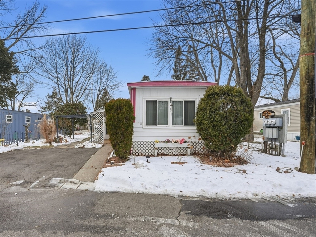 40 Better Way Springfield, MA 01119 - Photo 2 of 25 a front view of a house with a yard covered with snow in front of house