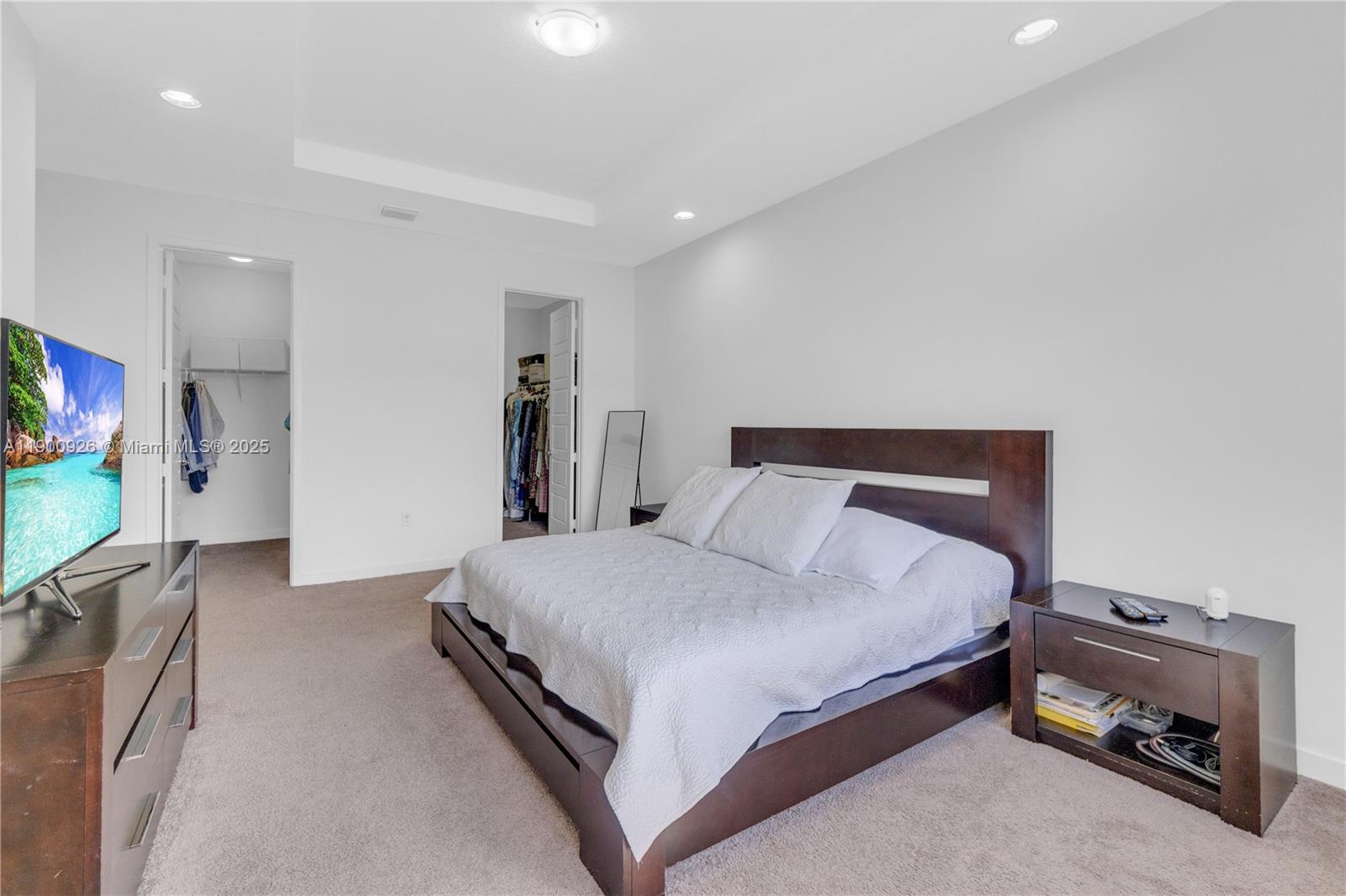 15288 Southwest 176th Terrace Miami, FL 33187 - Photo 20 of 68 a bedroom with a bed and a flat screen tv