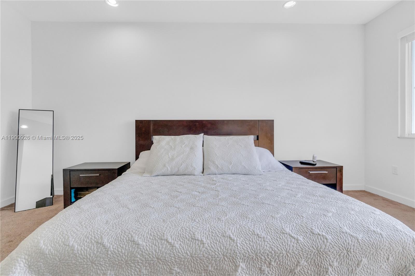 15288 Southwest 176th Terrace Miami, FL 33187 - Photo 22 of 68 a bedroom with a bed and a night stand