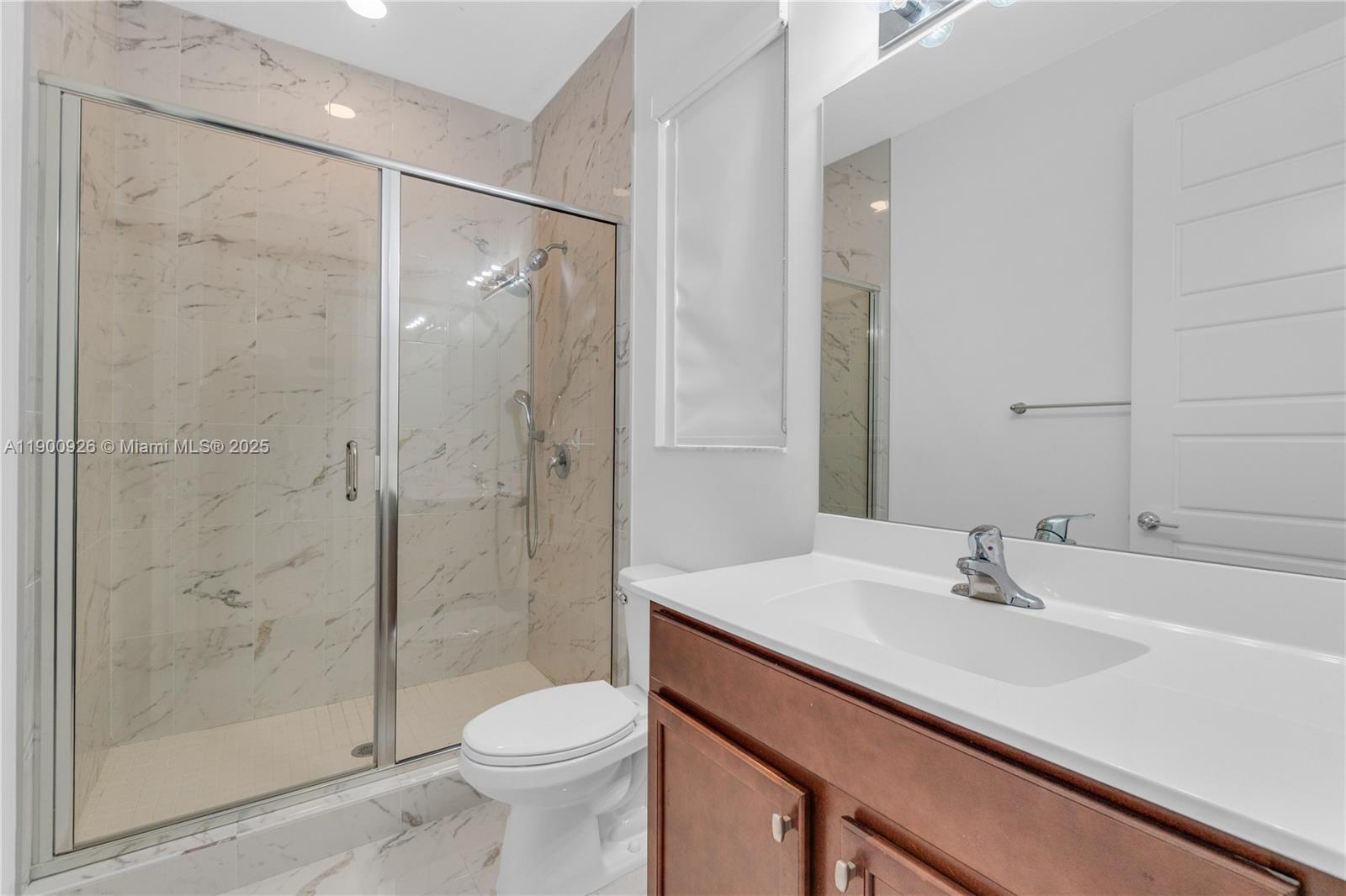 15288 Southwest 176th Terrace Miami, FL 33187 - Photo 31 of 68 a bathroom with a sink toilet and shower