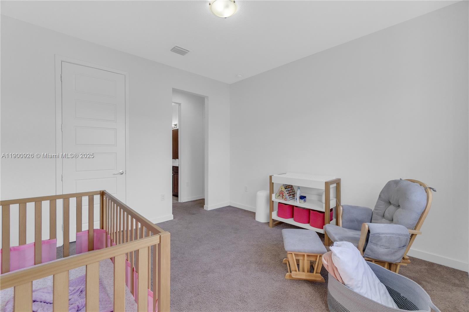 15288 Southwest 176th Terrace Miami, FL 33187 - Photo 37 of 68 a living room with furniture and a chair