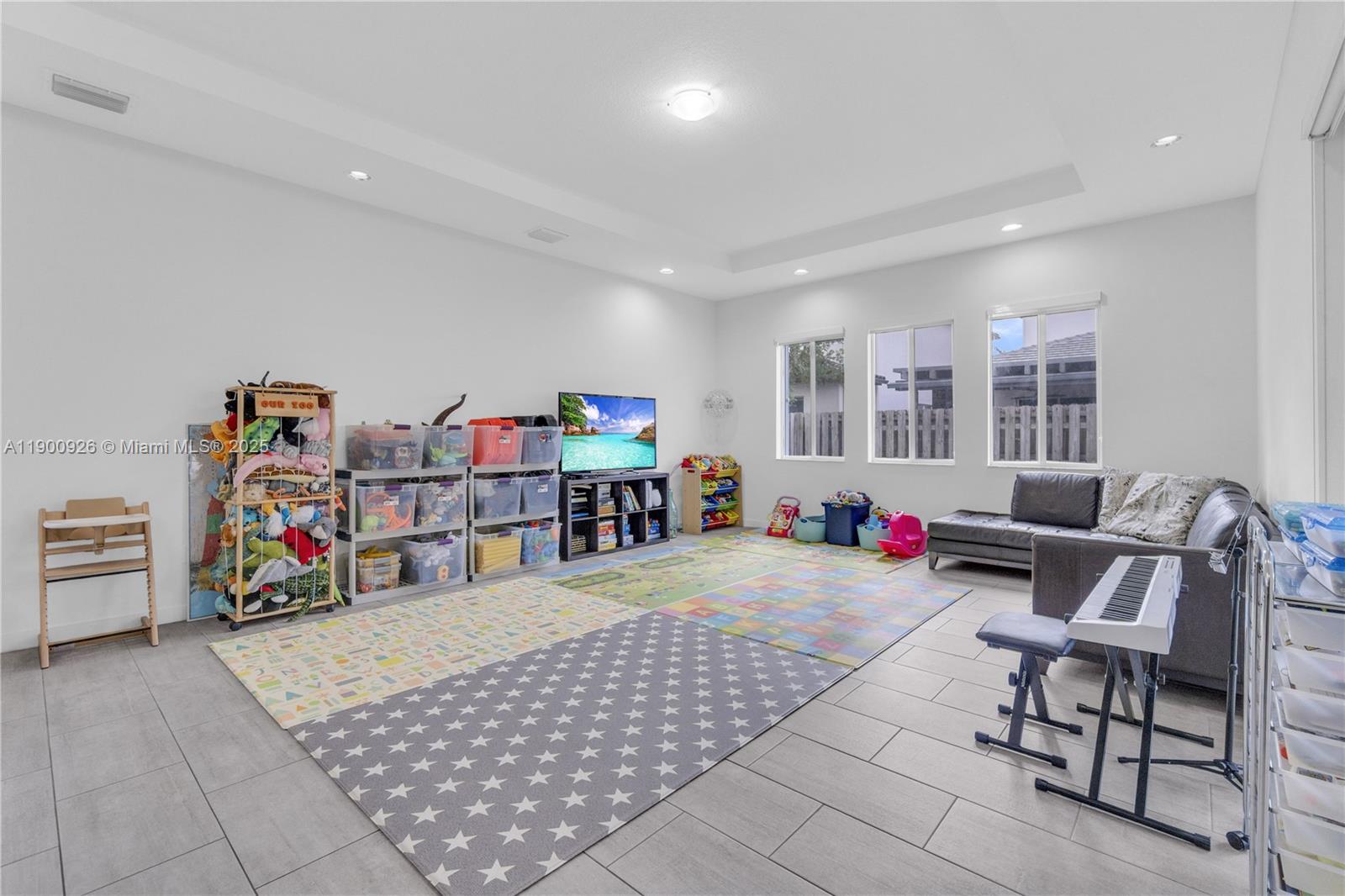 15288 Southwest 176th Terrace Miami, FL 33187 - Photo 40 of 68 a room with lots of furniture and white walls