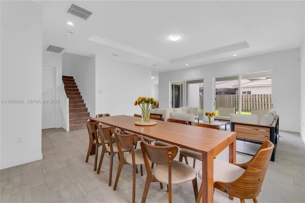 a living room with furniture and a table