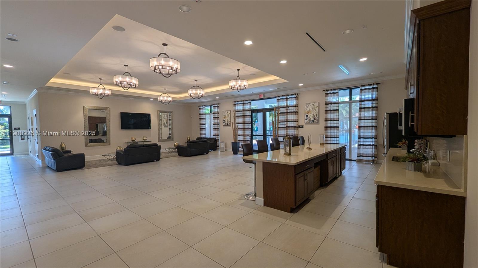 15288 Southwest 176th Terrace Miami, FL 33187 - Photo 61 of 68 a large living room with stainless steel appliances kitchen island granite countertop a large counter top and living room view