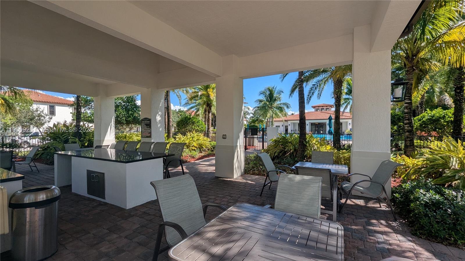 15288 Southwest 176th Terrace Miami, FL 33187 - Photo 67 of 68 a living room with furniture a potted plant and a large window