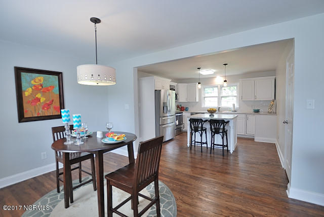 Dining area and breakfast bar, with hardwood floors