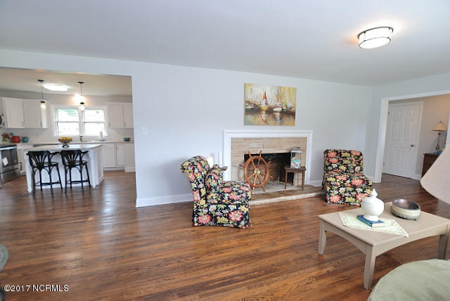 3308 Amherst Road Rocky Mount, NC 27804 - Photo 10 of 19 Hardwood floors and fireplace in greatroom