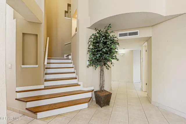 a kitchen with stainless steel appliances granite countertop a stove and cabinets