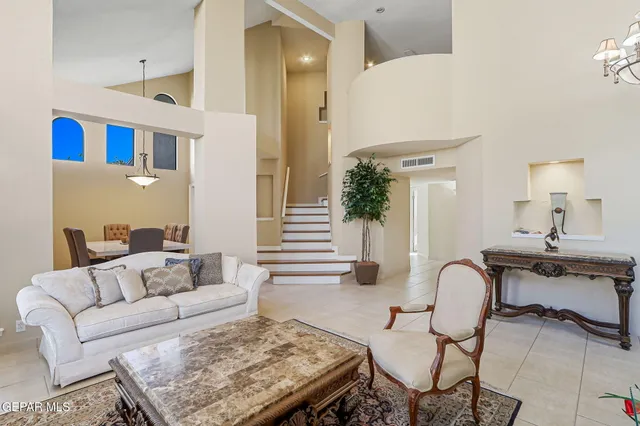 a work room with furniture and a ceiling fan