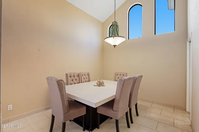 a metallic refrigerator freezer sitting in a kitchen